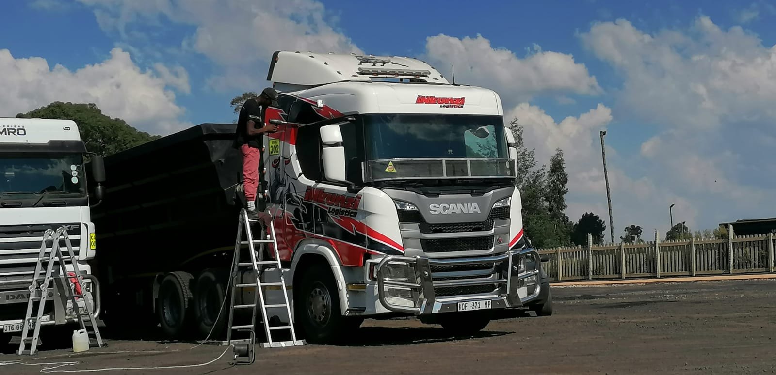 Commercial truck cab vinyl wrap installation on site